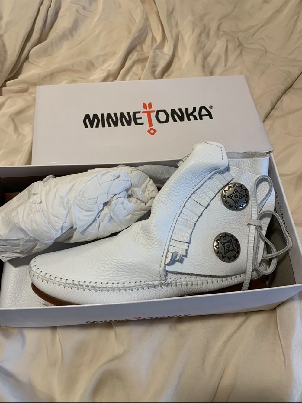 NEW with box. Minnetonka White Leather Fringe Moccasin with Concho Buttons